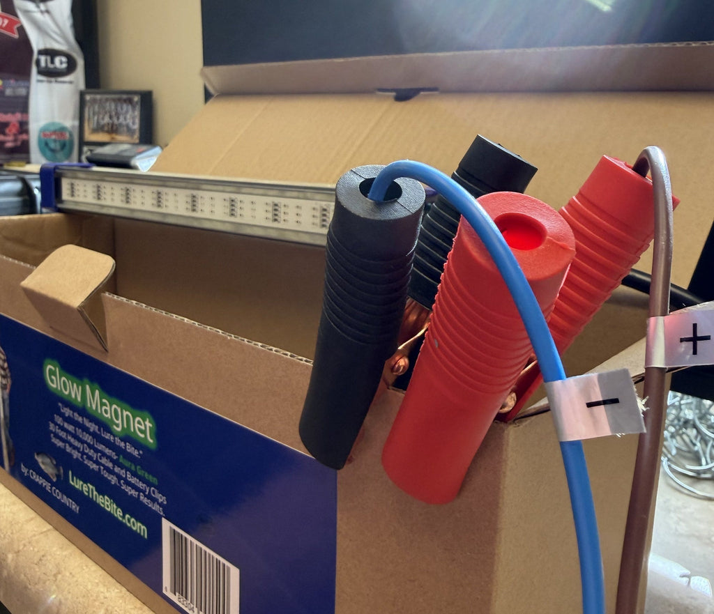 Red and black battery clips on the Glow Magnet light cord